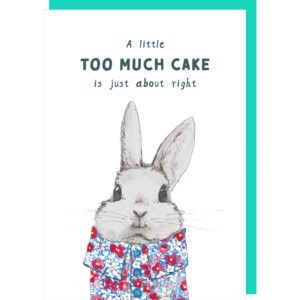 cute birthday card with an image of a raabit dressed in a floral blouse, caption reads 'A little too much cake is just about right'.